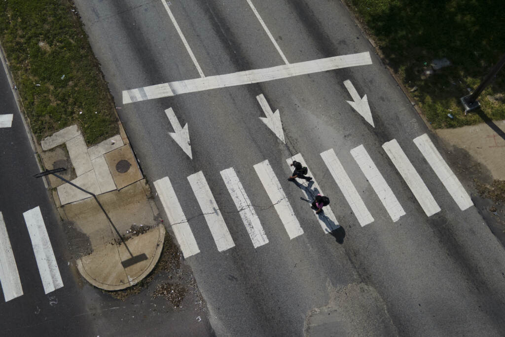 Pedestrians cross Roosevelt Boulevard at the intersection with North Mascher Avenue