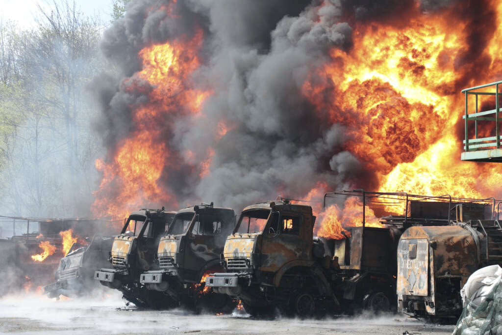 APTOPIX Ukraine Russia Vehicles on fire at the oil depot after missiles struck the facility in an area controlled by Russian-backed separatist forces