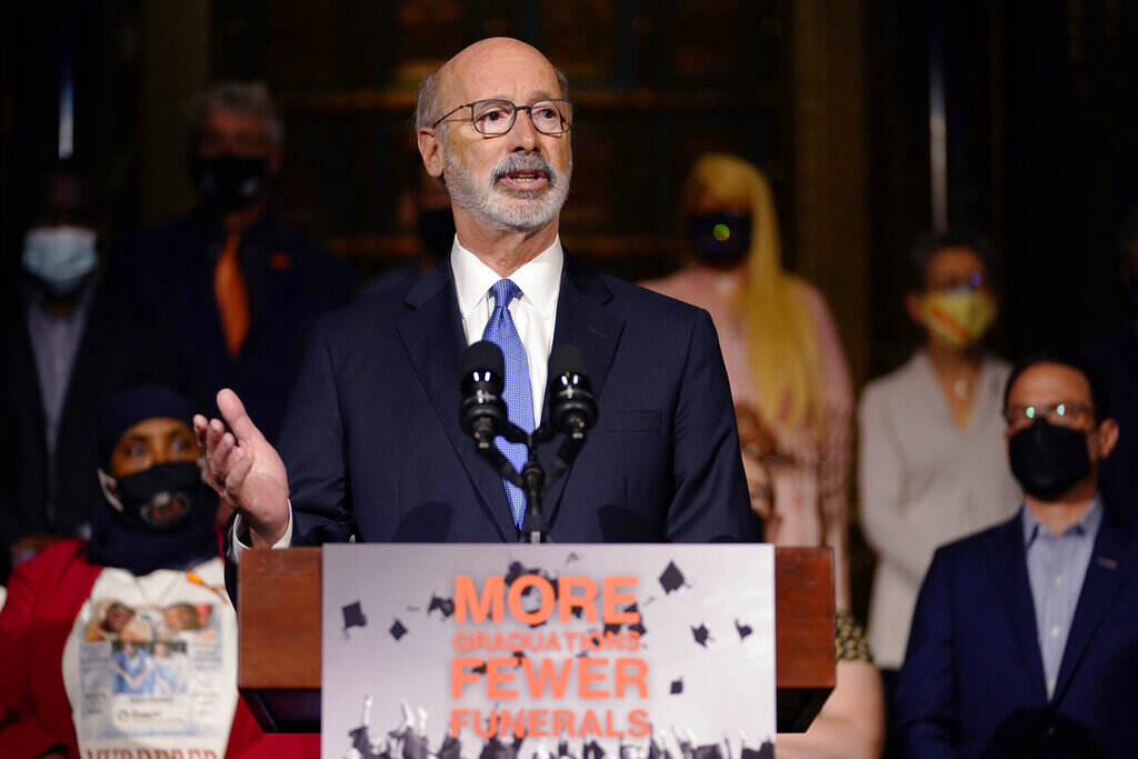 Texas School Shooting Governors Gov. Tom Wolf speaks from a podium.