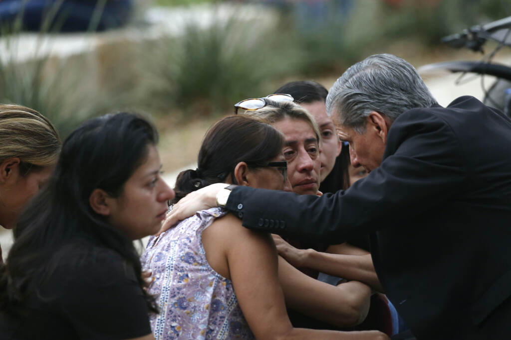 Texas School Shooting The Archbishop of San Antonio, Gustavo Garcia Seller comforts families outside of the Civic Center in Uvalde