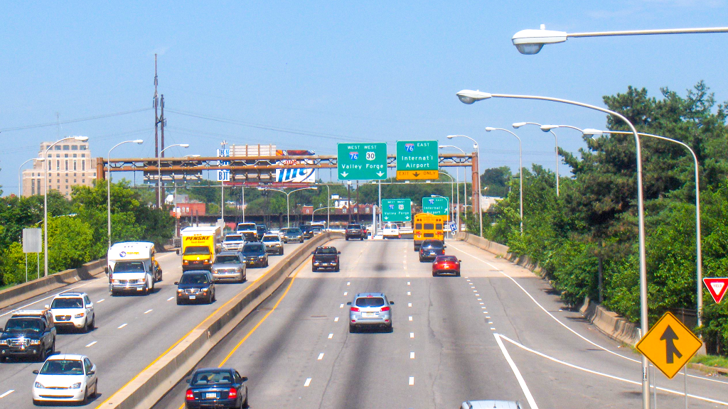 vinestreetexpressway-highway-1024×576 Aerial view of the Vine Street Expressway on a sunny day.