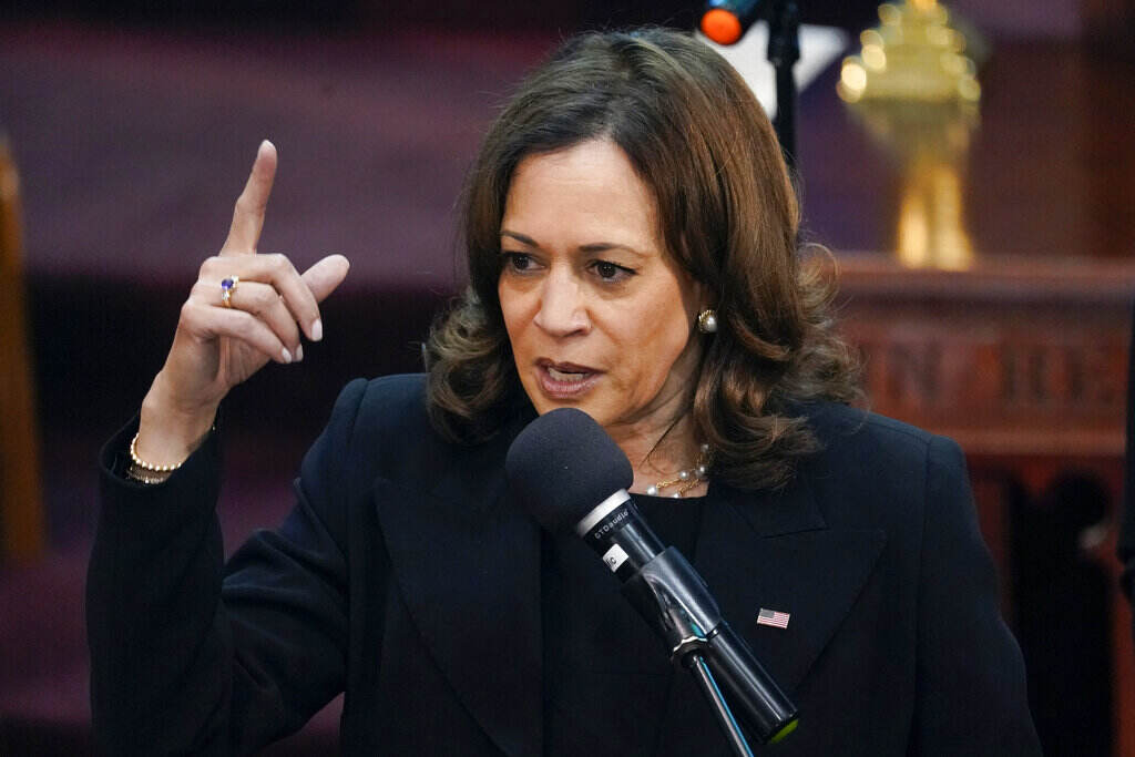 Kamala Harris A close-up of Vice President Kamala Harris, dressed in black, pointing emphatically as she speaks at the funeral of one of the victims of the Buffalo shooting attack.