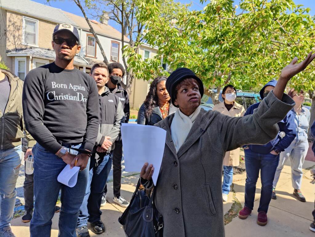 Penny Washington shows actor Reggie White and the rest of the cast and crew of the new play 'Bayard Rustin Inside Ashland' the historic A.M.E. church in West Chester where Rustin grew up. (Peter Crimmins/WHYY)