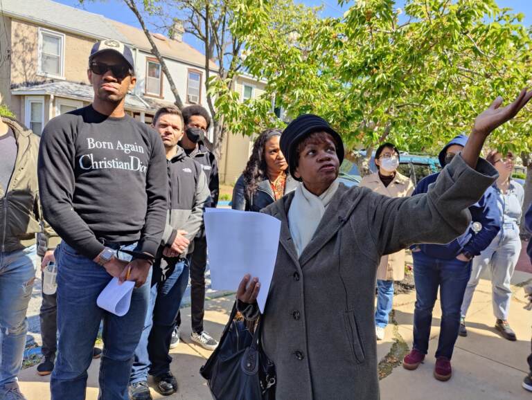 Penny Washington shows actor Reggie White and the rest of the cast and crew of the new play 'Bayard Rustin Inside Ashland' the historic A.M.E. church in West Chester where Rustin grew up. (Peter Crimmins/WHYY)