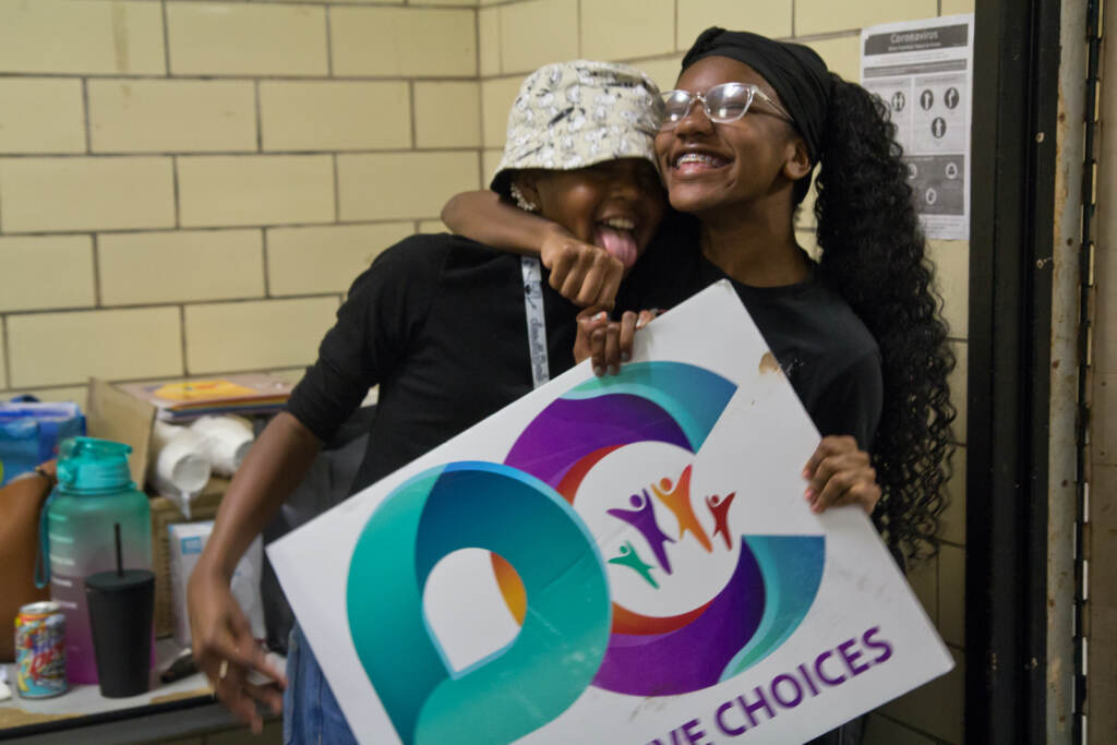 McKayla Davis (left) is embraced by her sister, Layla Davis
