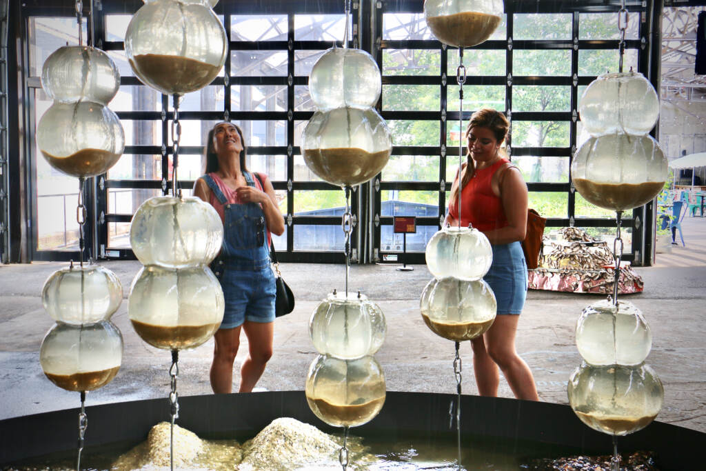 2022 06 17-e lee-cristina conyers jazmin hurtado-philadelphia cherry street pier-freshwater art installation jean shin Cristina Conyers (left) and Jazmin Hurtado, visitors to Philadelphia from Los Angeles, check out Jean Shin's ''Freshwater'' at the Cherry Street Pier in June 2022.