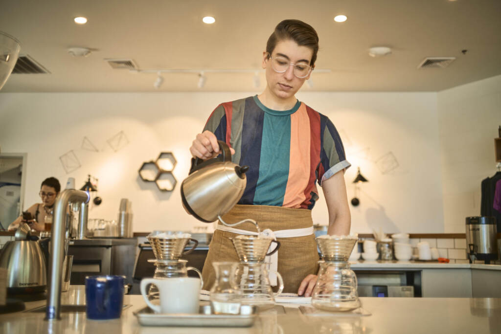 Barista Steph Achter, who led the union campaign at the Milwaukee café now known as Likewise, has worked in different coffee shops for 17 years and wants others to be able to make a career of it as well. Steph Achter pours water into a glass carafe at a coffee shop