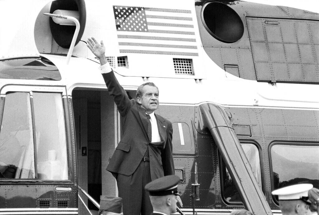 Impeachment Nixon and Trump In this Aug. 9, 1974 file photo, President Richard Nixon waves goodbye from the steps of his helicopter outside the White House, after he gave a farewell address to members of the White House staff after resigning. (AP Photo/Chick Harrity)