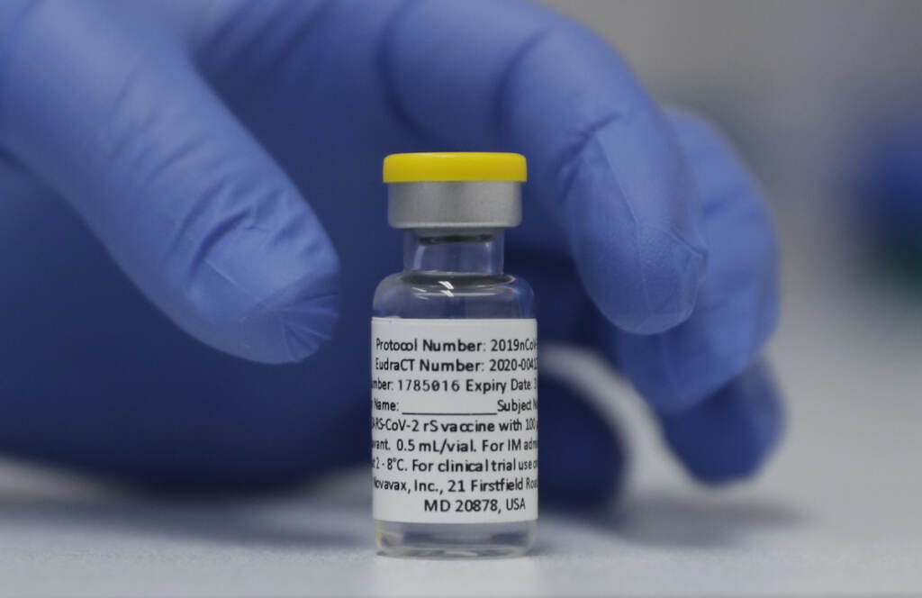 Virus Outbreak Novavax Vaccine In this Wednesday, Oct. 7, 2020, file photo, a vial of the Phase 3 Novavax coronavirus vaccine is seen ready for use in the trial at St. George's University hospital in London. (AP Photo/Alastair Grant, File)
