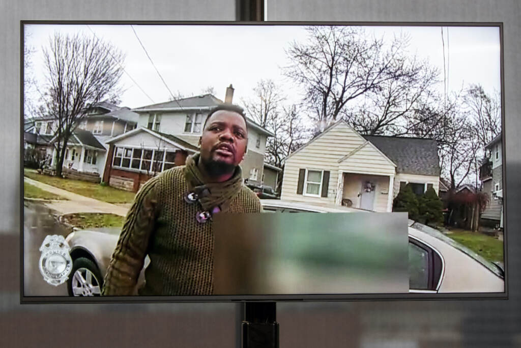 Police Shooting Michigan A TV display shows video evidence of a Grand Rapids police officer struggling with and shooting Patrick Lyoya at Grand Rapids City Hall on Wednesday, April 13, 2022. (Cory Morse | MLive.com)