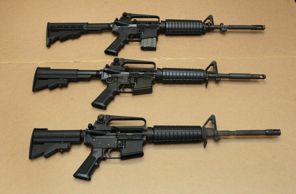 Texas School Shooting Age Limit FILE -Three variations of the AR-15 assault rifle are displayed at the California Department of Justice in Sacramento, Calif., on Aug. 15, 2012. (AP Photo/Rich Pedroncelli, File)