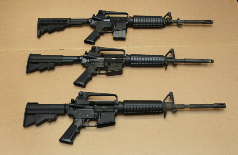FILE -Three variations of the AR-15 assault rifle are displayed at the California Department of Justice in Sacramento, Calif., on Aug. 15, 2012. (AP Photo/Rich Pedroncelli, File)