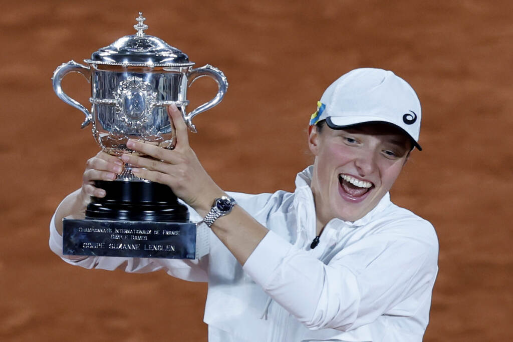 France Tennis French Open Poland's Iga Swiatek celebrates with the cup after defeating Coco Gauff of the U.S.in their final of the French Open tennis tournament at the Roland Garros stadium Saturday, June 4, 2022 in Paris. (AP Photo/Jean-Francois Badias)