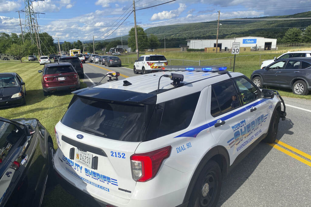 Shooting Maryland Law enforcement stages near the scene of a shooting at Columbia Machine, Inc., in Smithsburg, Md., Thursday, Jan. 9, 2022. (AP Photo/Tim Jacobsen)