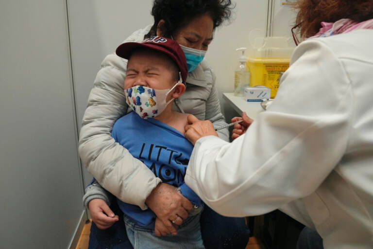 FILE - A boy receives a dose of China's Sinovac COVID-19 coronavirus vaccine at a community vaccination center in Hong Kong on Feb. 25, 2022. U.S. government advisers met Wednesday, June 15, 2022 to decide whether to endorse COVID-19 shots for babies, toddlers and preschoolers, moving the nation closer to vaccinations for all ages. According to the World Health Organization, 12 countries are vaccinating kids under 5. (AP Photo/Kin Cheung, File)
