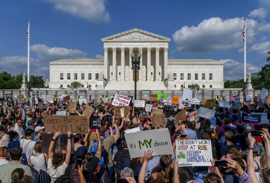 Supreme Court Abortion Abortion-rights and anti-abortion demonstrators gather outside of the Supreme Court in Washington, Friday, June 24, 2022. The Supreme Court has ended constitutional protections for abortion that had been in place nearly 50 years, a decision by its conservative majority to overturn the court's landmark abortion cases. (AP Photo/Gemunu Amarasinghe)
