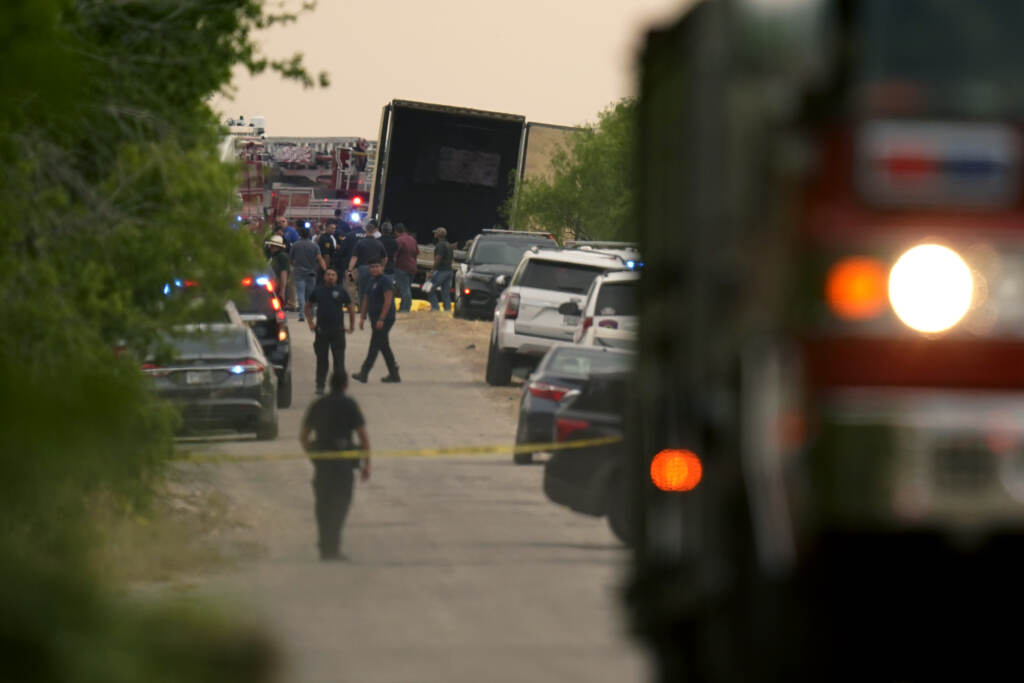 Migrant Deaths Body bags lie at the scene where a tractor trailer with multiple dead bodies was discovered, Monday, June 27, 2022, in San Antonio. (AP Photo/Eric Gay)