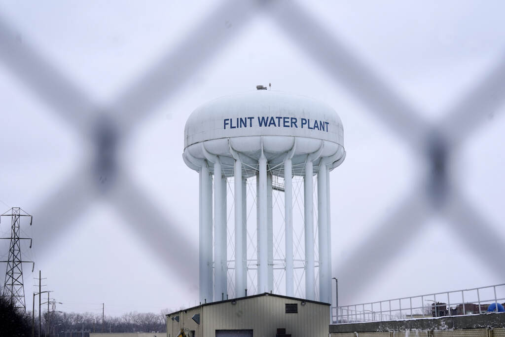 Flint Water Timeline File photo: The Flint water plant tower is seen, Thursday, Jan. 6, 2022, in Flint, Mich. (AP Photo/Carlos Osorio, File)