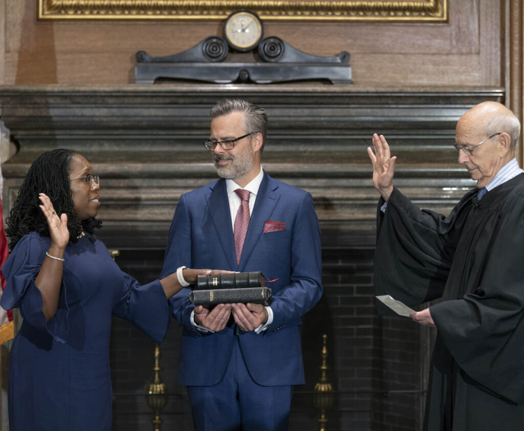 Supreme Court Jackson In this image provided by Collection of the Supreme Court of the United States, retired Supreme Court Justice Stephen Breyer administers the Judicial Oath to Ketanji Brown Jackson as her husband Patrick Jackson holds the Bible at the Supreme Court in Washington, Thursday, June 30, 2022. (Fred Schilling/Collection of the Supreme Court of the United States via AP)
