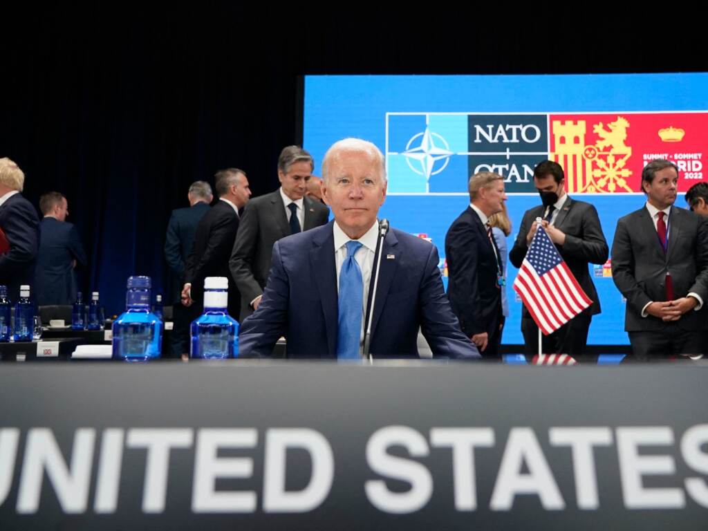 President Biden waits for the start of a roundtable meeting at the NATO summit in Madrid. He announced the U.S. would increase its military presence in Europe. President Joe Biden waits for the start of a roundtable meeting at a NATO summit in Madrid