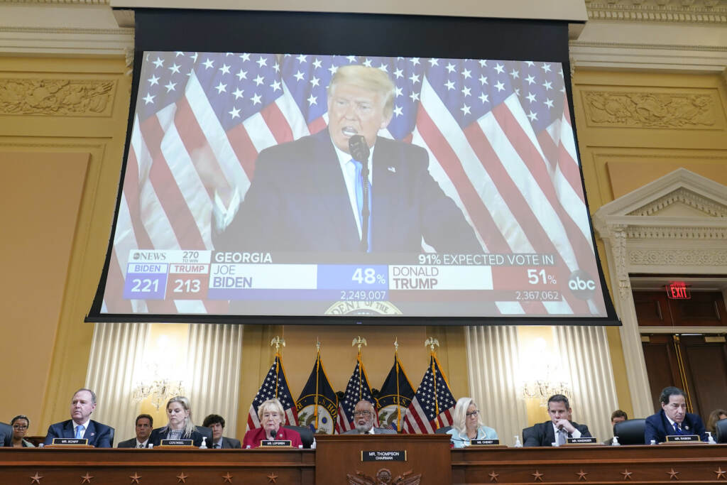 A video exhibit plays as the House select committee investigating the Jan. 6 attack on the U.S. Capitol continues to reveal its findings of a year-long investigation, at the Capitol in Washington