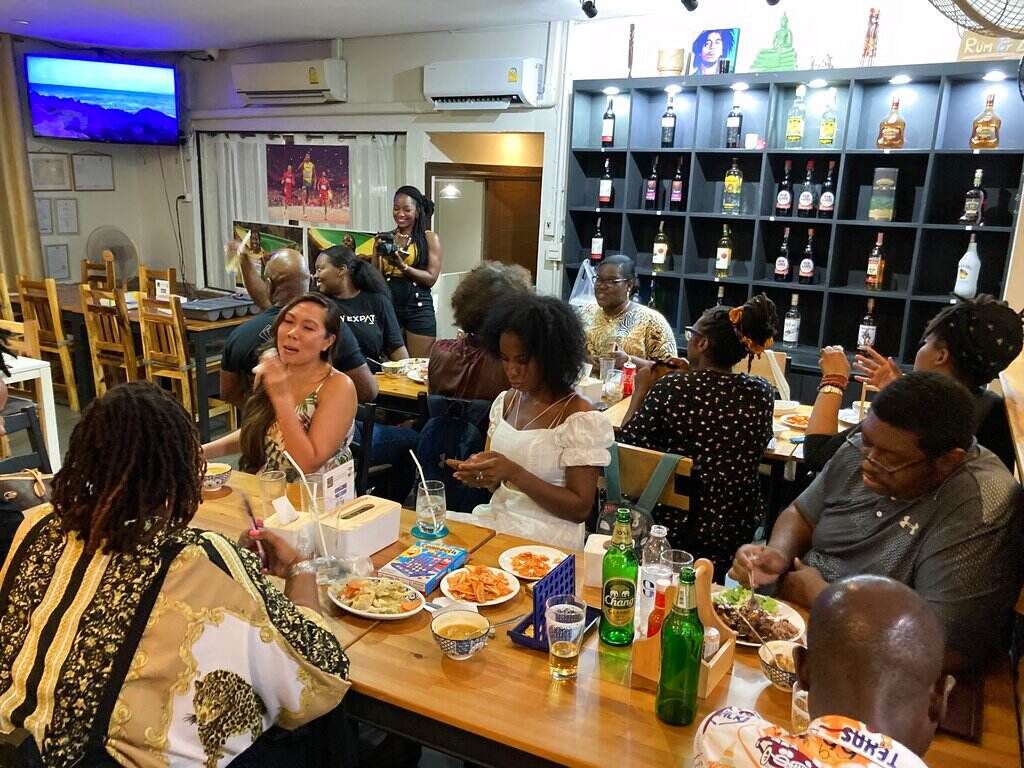 Juneteenth Americans Abroad A view from above shows a group of people at a restaurant.
