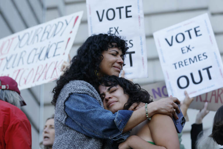 Mitzi Rivas, left, hugs her daughter Maya Iribarren during an abortion-rights protest at City Hall in San Francisco
