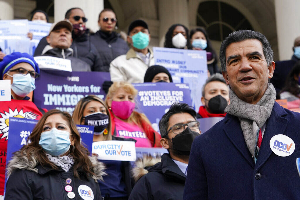 Ydanis Rodriguez A councilmember speaks in front of a crowd of people in New York City.