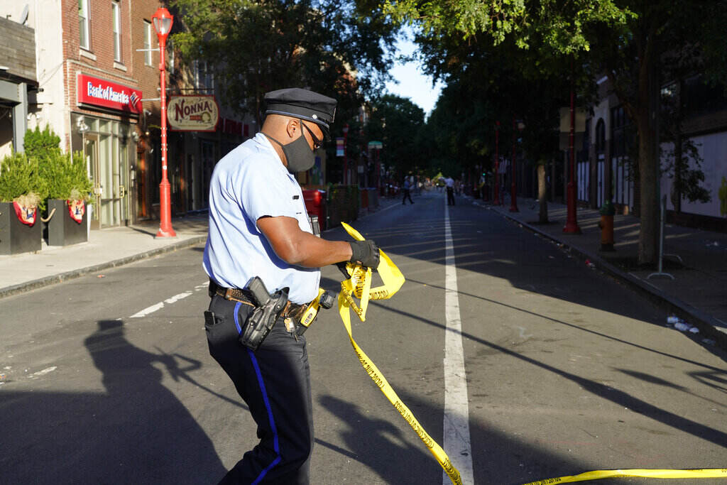 Philadelphia Shooting Philadelphia Police investigators work the scene of a fatal overnight shooting on South Street in Philadelphia, Sunday, June 5, 2022.