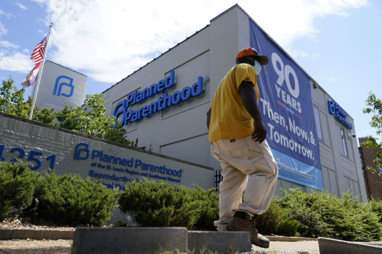 A person walks past Planned Parenthood