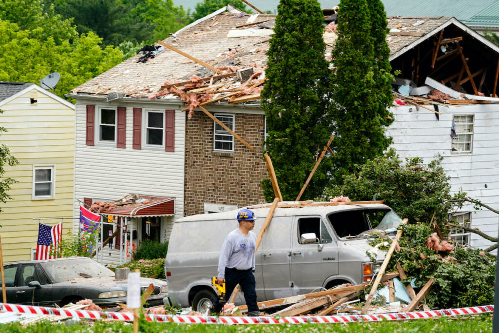 Fatal Home Explosion An investigator moves through the scene of a deadly explosion in a residential neighborhood in Pottstown