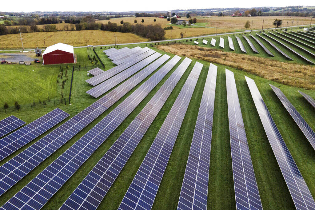 Aerial view of solar panels on a farm.