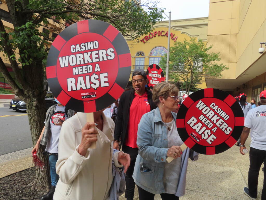 Members of Local 54 of the Unite Here casino workers union picket outside the Tropicana casino