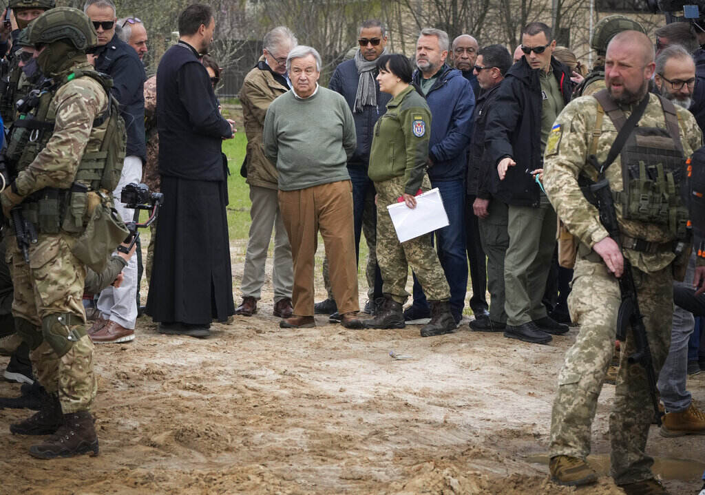 Antonio Guterres File photo: U.N. Secretary-General Antonio Guterres, center, stands on the side of a mass grave in Bucha, on the outskirts of Kyiv, Ukraine, Thursday, April 28, 2022. Police are investigating the killings of more than 12,000 Ukrainians nationwide in the war Russia is waging, the national police chief said Monday. In the Kyiv region near Bucha, authorities showed several victims whose hands were tied behind their backs.