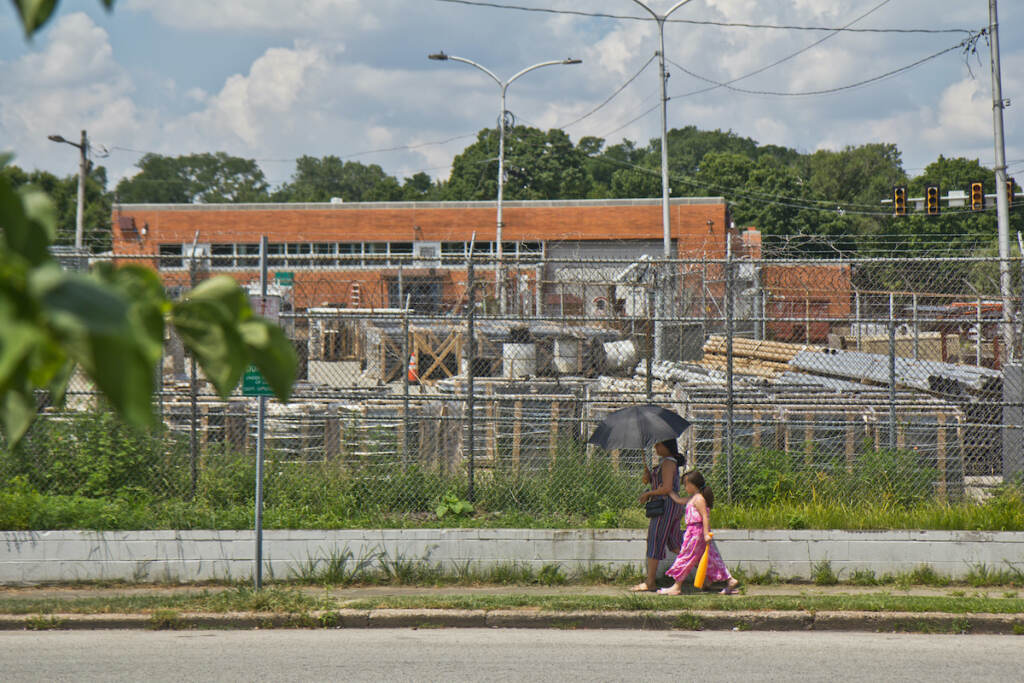 2022 07 20 k paynter heat photos 2022 (1 of 1)-2 A woman uses an umbrella for protection from the sun in Juniata Park