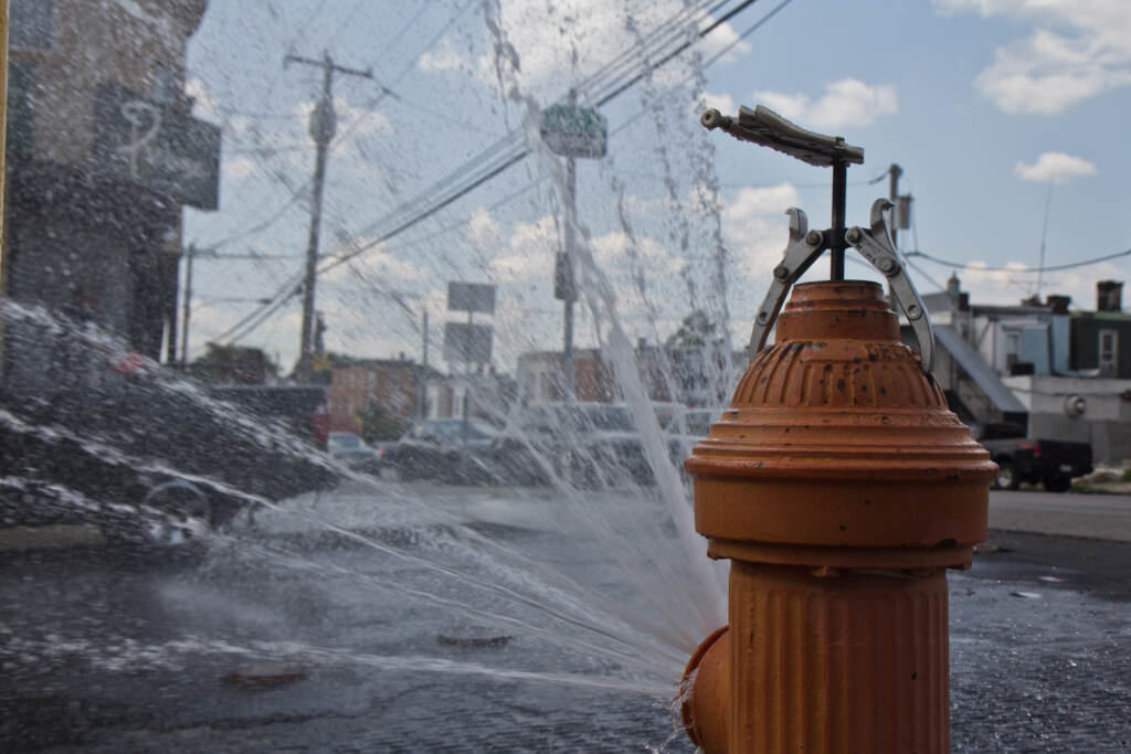 2022 07 20 k paynter heat photos 2022 (1 of 1)-6 An open fire hydrant is pictured on Reese Street in Philly's Hunting Park neighborhood