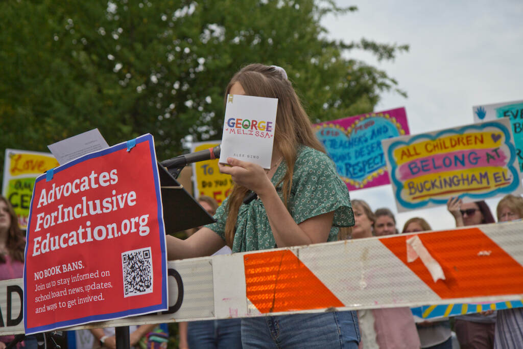 2022 07 26 k paynter lilly freeman CBSD book ban rally (1 of 1) Lilly Freeman holds up a that helped her transition at a rally ahead of the Central Bucks School District’s vote to remove books perceived to have sexualized content from their libraries