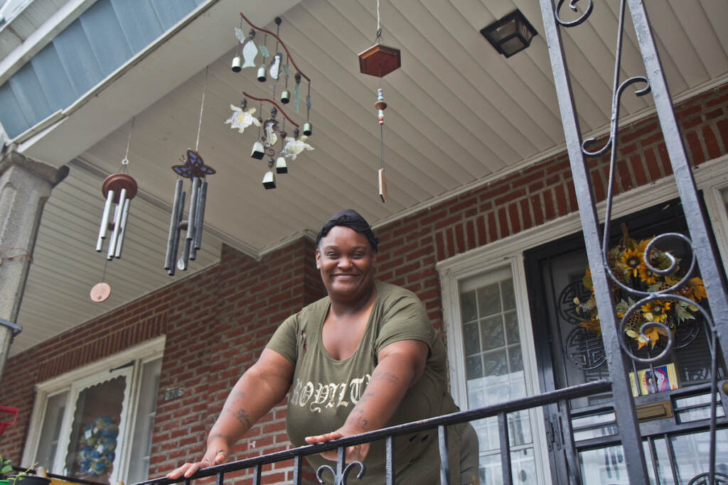 2022 07 29 k paynter felicia ashley ac unit recipient (1 of 1)-2 Felicia Ashley on her porch in the East Germantown section of Philadelphia. (Kimberly Paynter/WHYY)