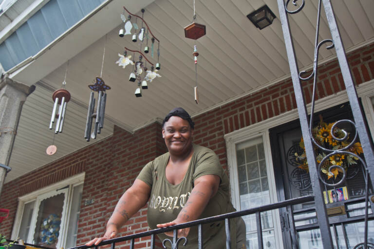 Felicia Ashley on her porch in the East Germantown section of Philadelphia. (Kimberly Paynter/WHYY)