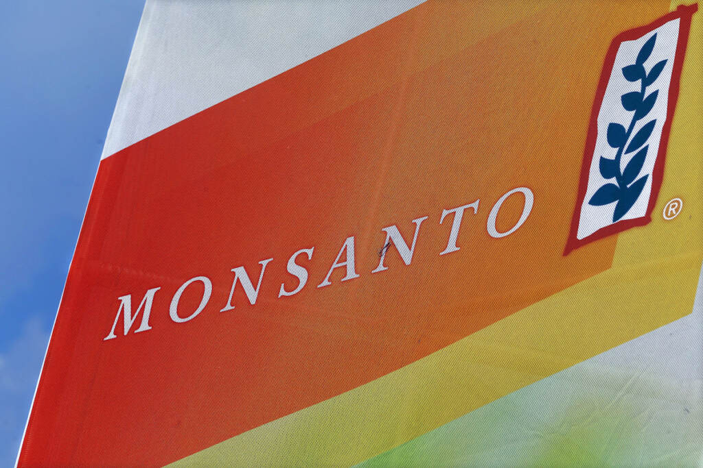 This Aug. 31, 2015 file photo shows the Monsanto logo on display at the Farm Progress Show in Decatur, Ill. (AP Photo/Seth Perlman, File)