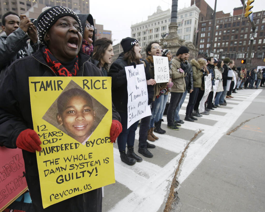 In this Nov. 25, 2014 file photo, demonstrators block Public Square in Cleveland, during a protest over the police shooting of 12-year-old Tamir Rice. (AP Photo/Tony Dejak, File)