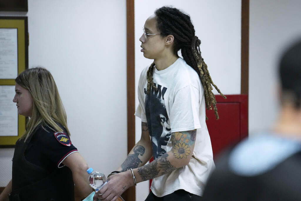 Brittney Griner WNBA star and two-time Olympic gold medalist Brittney Griner is escorted to a courtroom for a hearing, in Khimki just outside Moscow, Russia, Friday, July 1, 2022. (AP Photo/Alexander Zemlianichenko)