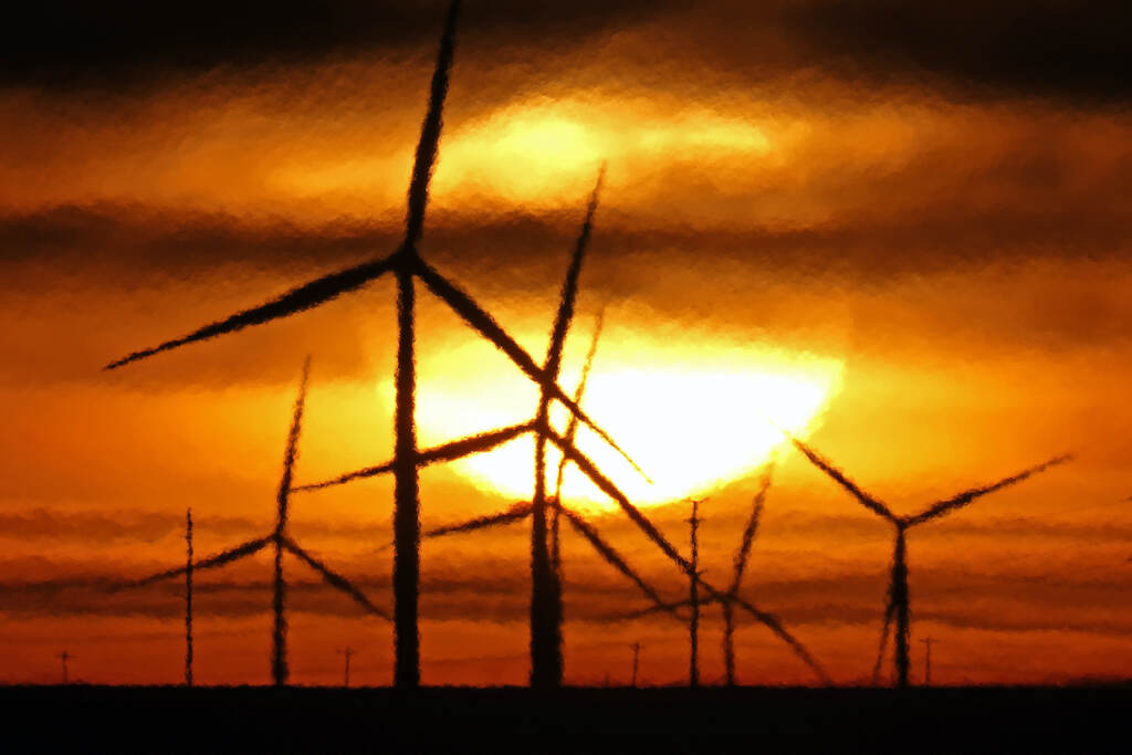 Supreme Court Climate States File photo: Wind turbines are silhouetted against the rising sun Wednesday, Jan. 13, 2021, near Spearville, Kan. (AP Photo/Charlie Riedel, File)