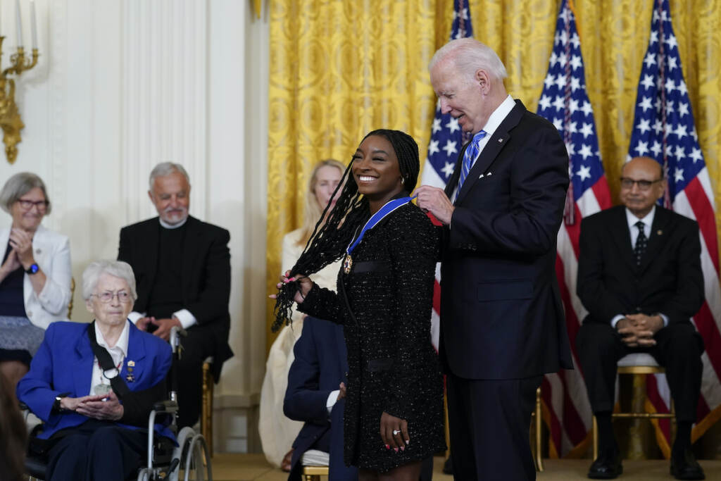 Joe Biden President Joe Biden awards the nation's highest civilian honor, the Presidential Medal of Freedom, to gymnast Simone Biles during a ceremony in the East Room of the White House in Washington, Thursday, July 7, 2022. (AP Photo/Susan Walsh)