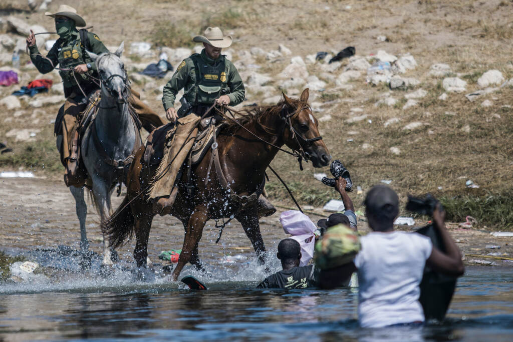 Border Patrol Investigation File photo: Mounted U.S. Border Patrol agents attempt to contain migrants as they cross the Rio Grande from Ciudad Acuña, Mexico, into Del Rio, Texas, Sept. 19, 2021.(AP Photo/Felix Marquez, File)