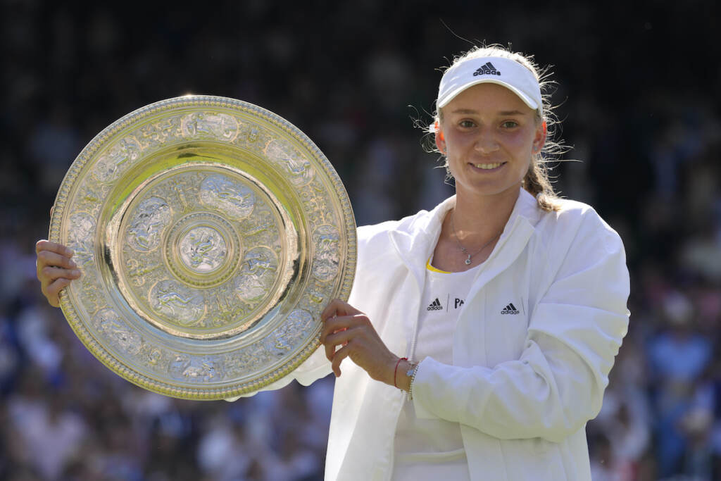 Britain Wimbledon Tennis Kazakhstan's Elena Rybakina holds the trophy as she celebrates after beating Tunisia's Ons Jabeur to win the final of the women's singles on day thirteen of the Wimbledon tennis championships in London, Saturday, July 9, 2022. (AP Photo/Kirsty Wigglesworth)