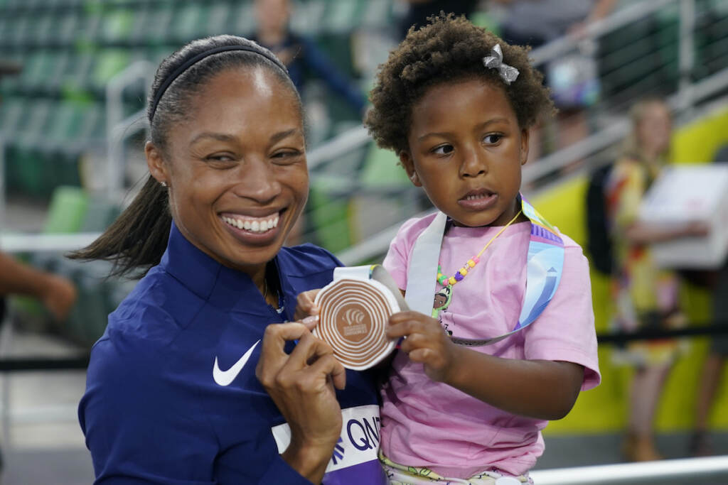 Worlds Athletics Allyson Felix, of the United States, gives her daughter Camryn her bronze medal after the 4x400-meter mixed relay final at the World Athletics Championships Friday, July 15, 2022, in Eugene, Ore. (AP Photo/Charlie Riedel)