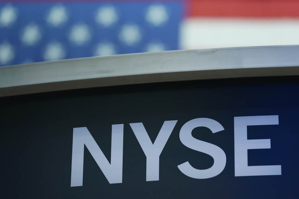 Financial Markets Wall Street File photo: A sign for New York Stock Exchange is displayed on the floor at the NYSE in New York, Wednesday, July 27, 2022. (AP Photo/Seth Wenig, File)