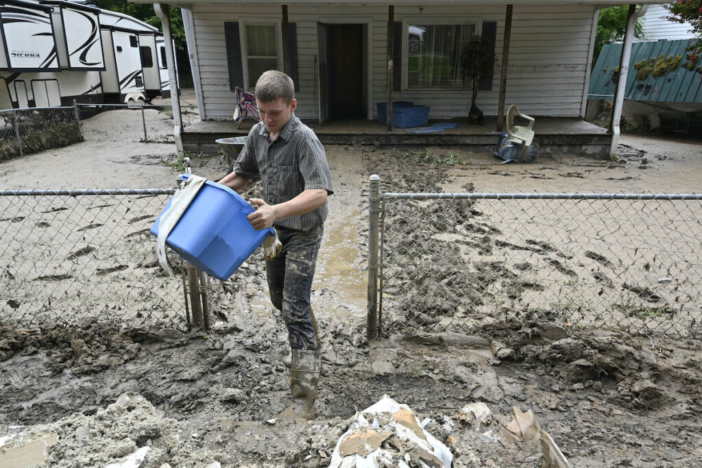 Severe Weather Appalachia Members of the local Mennonite community remove mud filled debris from homes following flooding at Ogden Hollar in Hindman, Ky., Saturday, July 30, 2022. (AP Photo/Timothy D. Easley)