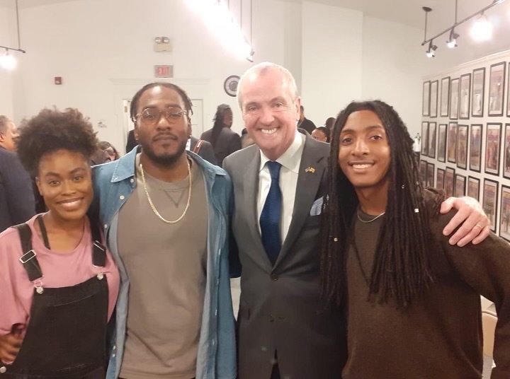 IMG_3558 Ayinde Merrill (second from the left) said he met with Gov. Phil Murphy in 2019. Also pictured Camile Wilson (left), Gov. Murphy (second to right), and Reet Starwind (right). (Courtesy Ayinde Merrill)